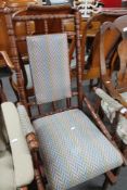 An antique style rocking chair in contemporary stripe.