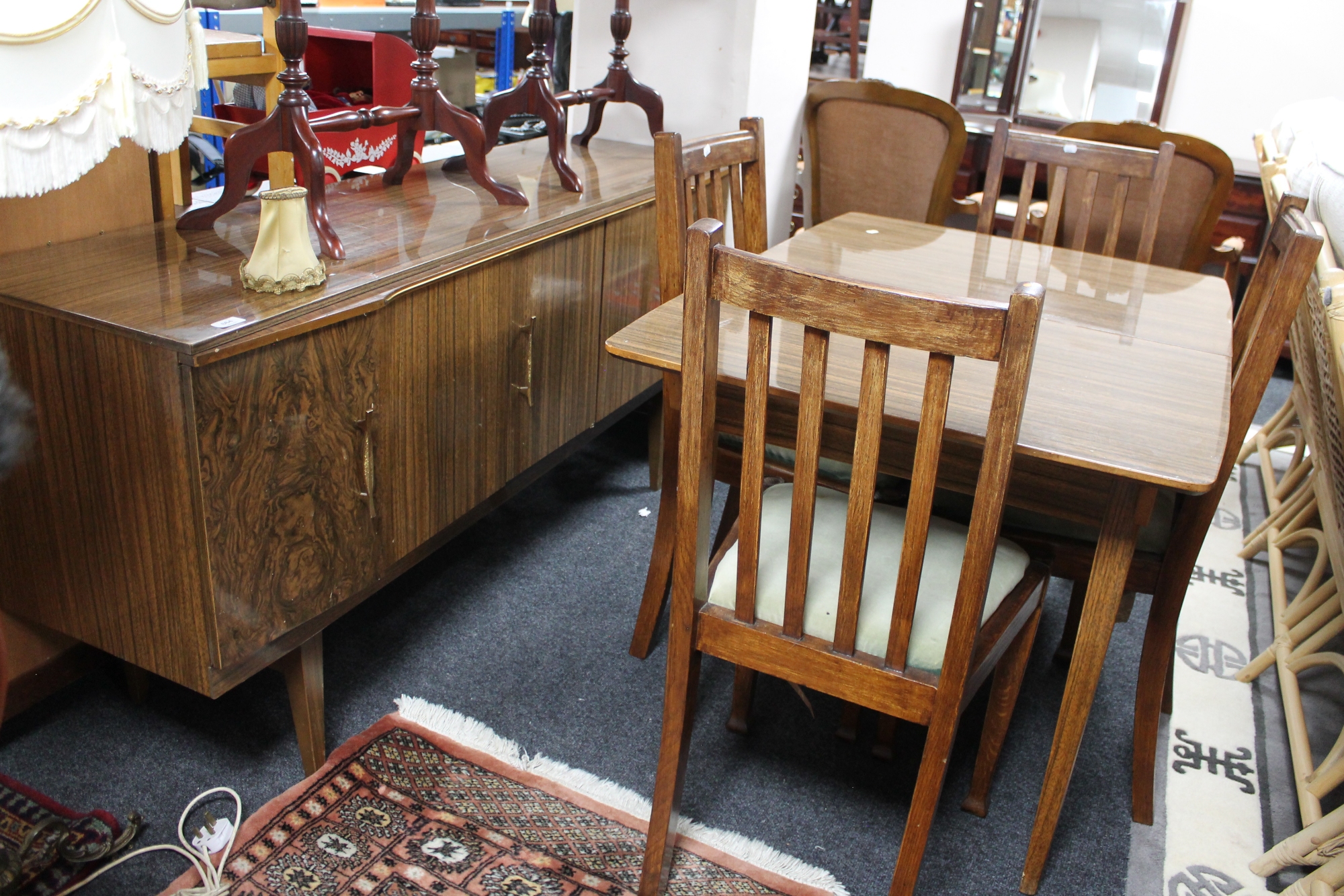 A mid century melamine dining table, four chairs and matching fully fitted cocktail sideboard.