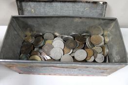 A vintage tin containing coins