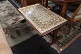 A mid century teak tiled coffee table