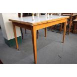 A mid century Formica topped extending kitchen table.