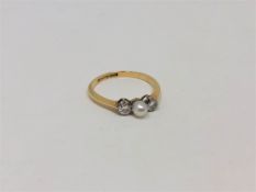 An 18ct gold pearl and diamond ring, size P. CONDITION REPORT: 2.4g.