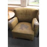 An Edwardian button back armchair