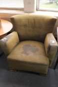 An Edwardian button back armchair