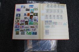 An album of stamps together with loose stamps