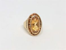 A large 14ct gold citrine and diamond ring, size R CONDITION REPORT: 8.