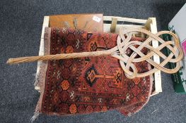 Two eastern rugs together with a carpet beater and a contemporary wall clock with pendulum and