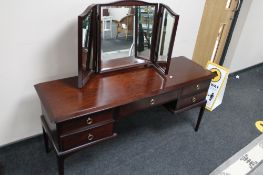 A Stag mirrored dressing table with stool CONDITION REPORT: 152cm long.
