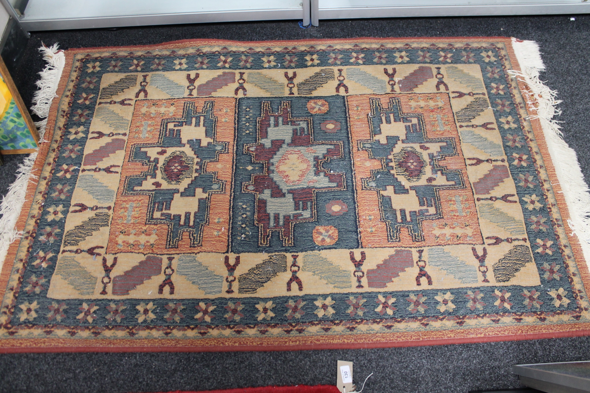 A contemporary eastern fringed rug