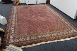 A large machined Persian design carpet