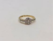 An 18ct gold diamond floral cluster ring, size J/K CONDITION REPORT: 2.