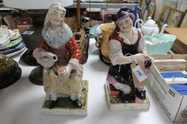 A pair of antique Staffordshire glazed pottery figures a/f