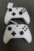 Microsoft X-Box : Two Controllers, both white.