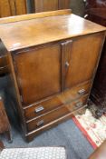 An oak linen cabinet