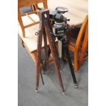Two vintage camera tripods.