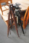 Two vintage camera tripods.