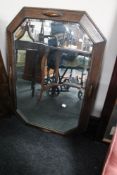 An Edwardian oak bevelled mirror