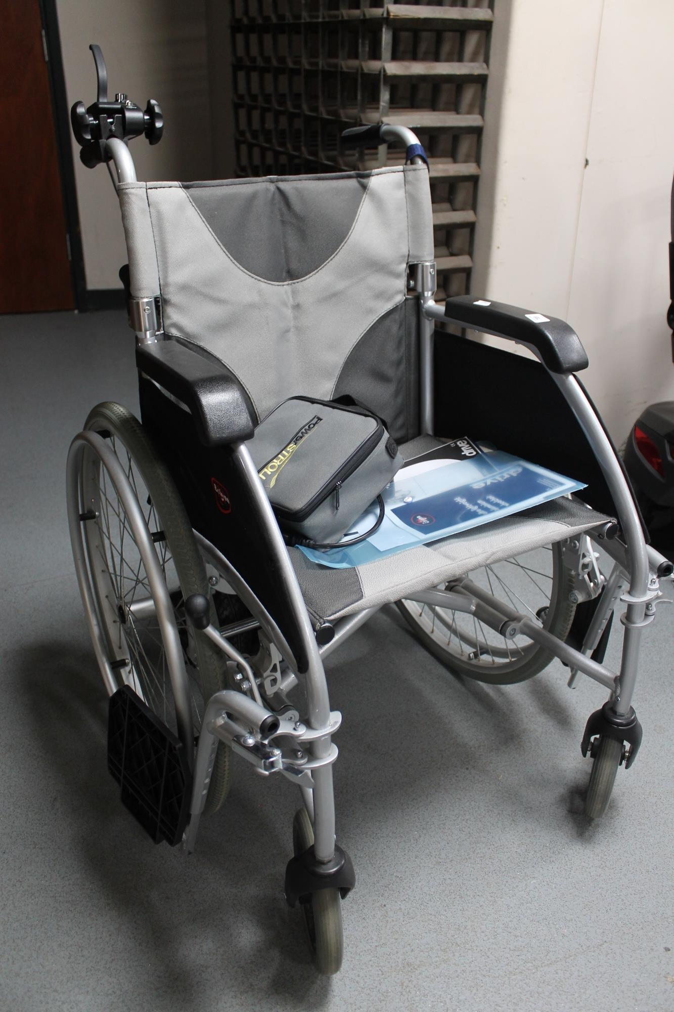 An Enigma ultra lightweight electric wheel chair with battery