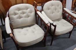 A pair of armchairs upholstered in grey two-tone fabric.