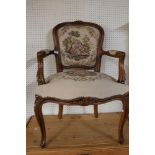A 19th century style carved walnut armchair.