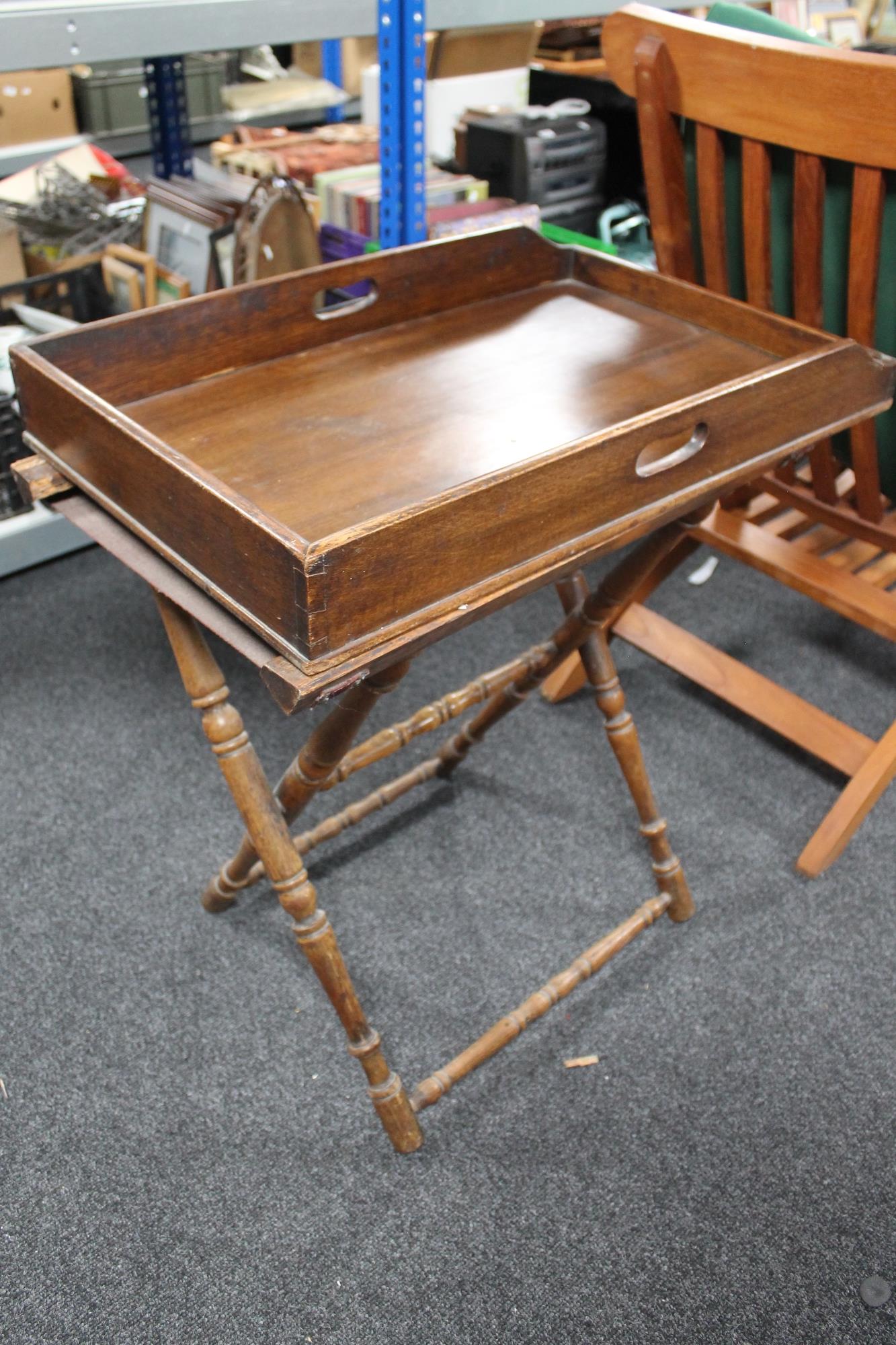 A mahogany butler's tray on stand