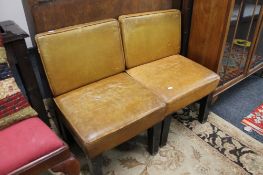 Two tan leather side chairs