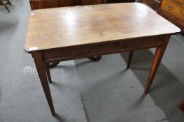 A 19th century mahogany table fitted a drawer.