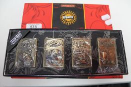 Three boxed sets of Zippo style lighters