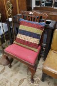 A nineteenth century oak chair together with a cushion