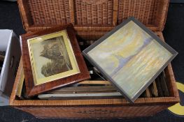 A large wicker trunk containing continental pictures and prints