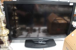 A Philips 32" LCD TV with remote