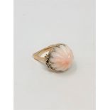 An unusual gold and coral ring, size M. CONDITION REPORT: 10.6g gross.