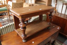A 19th century walnut two tier stand.