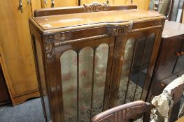 A 1930's carved oak bookcase