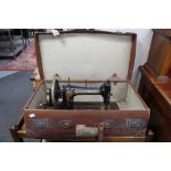 A Victorian Bradbury's sewing machine in vintage leather case