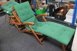 A pair of good quality teak steamer chairs with cushions (2)