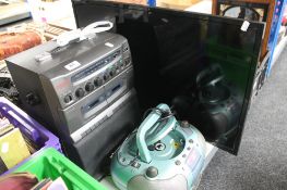 A Karaoke machine together with a mini hifi and a 32" Logik TV with remote control