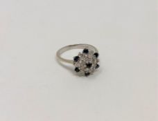 An 18ct gold sapphire and diamond ring, size K CONDITION REPORT: 3.2g.