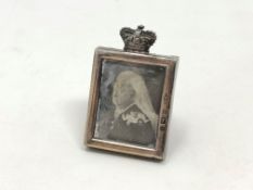 An antique miniature silver easel photograph frame showing Queen Victoria, Birmingham 1900,