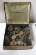 A vintage tin containing coins