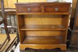 A reproduction yewwood bookcase