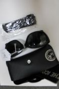 Ray-Ban : A pair of black sunglasses, with original case, booklet & cleaning cloth. (R.R.P. £140.