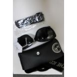 Ray-Ban : A pair of black sunglasses, with original case, booklet & cleaning cloth. (R.R.P. £140.