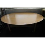 A light oak oval coffee table