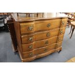 A 19th century oak four drawer serpentine fronted chest.