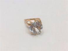 A gold ring set with a large pale blue stone, size K CONDITION REPORT: 6.