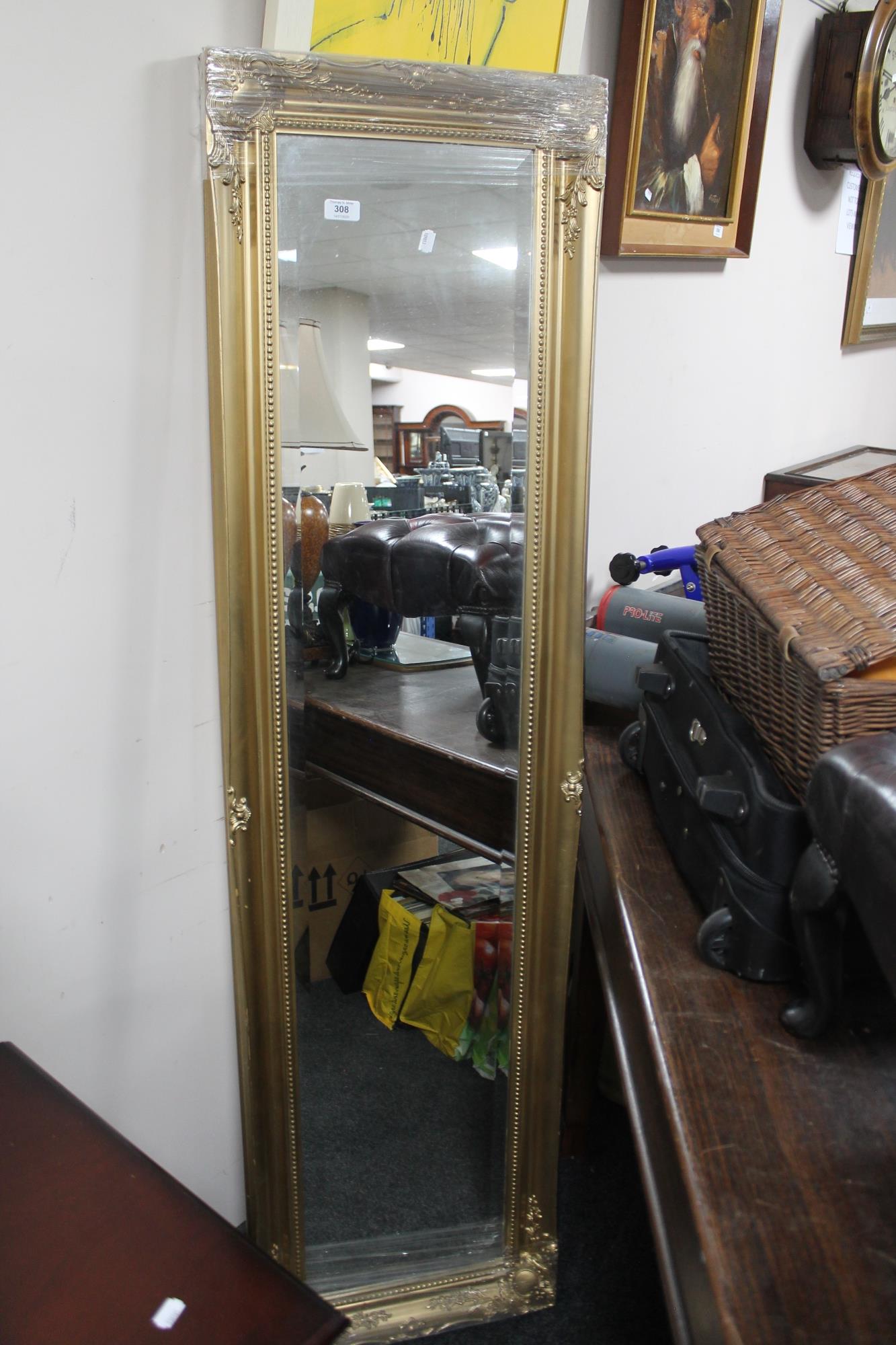 A gilt framed bevelled hall mirror