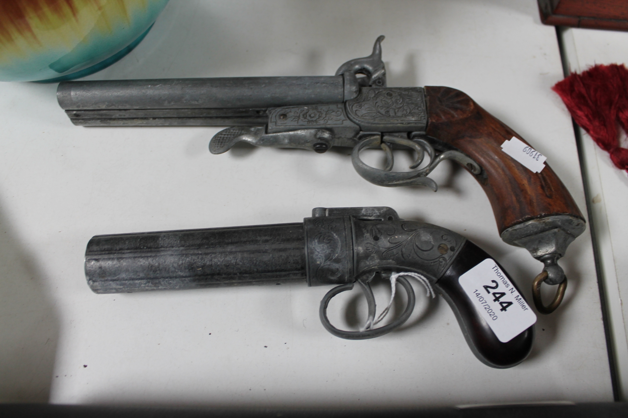 Two ornamental pistols