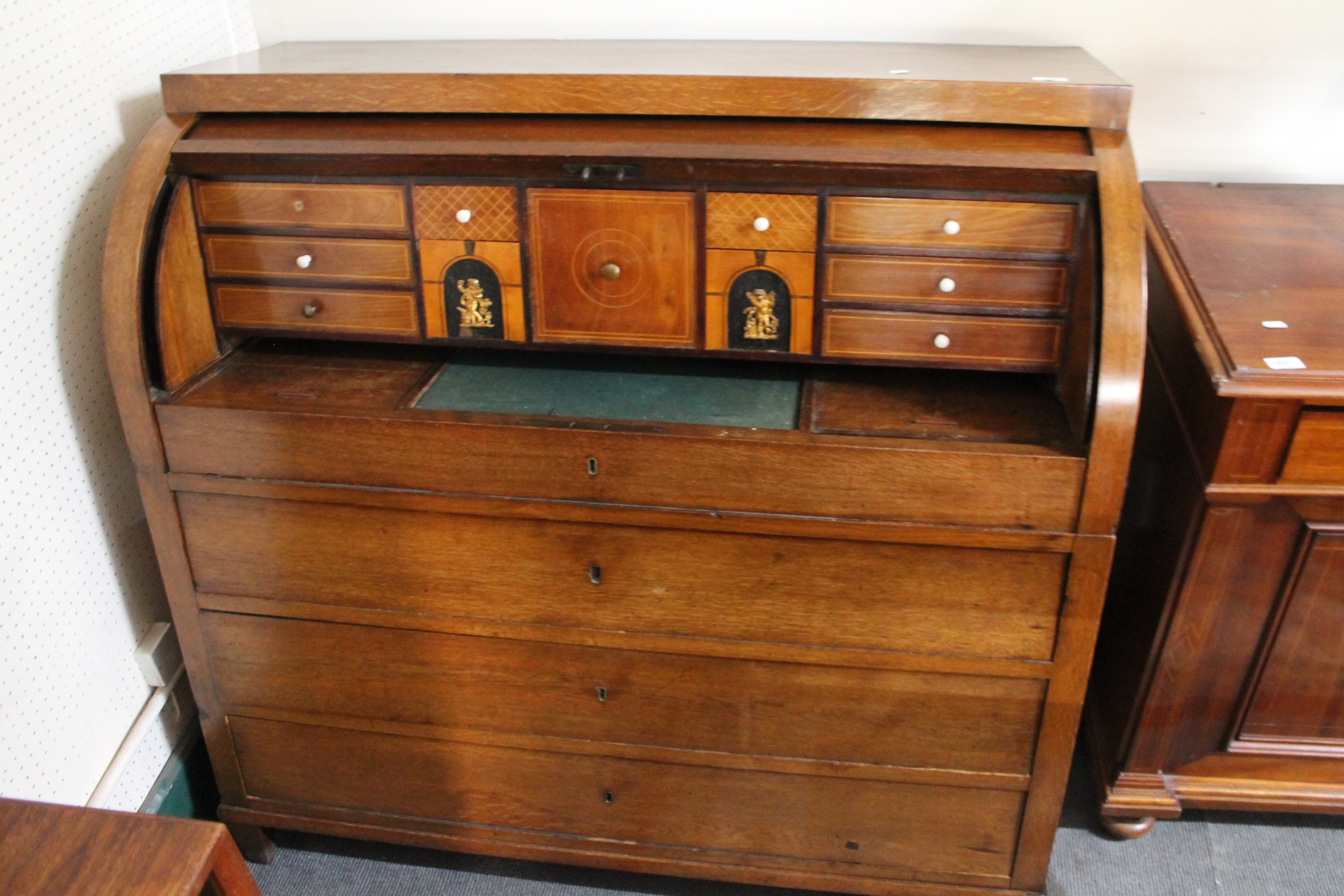 A 19th century oak cylinder bureau.