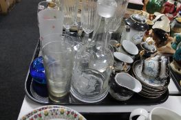 A tray of glass, champagne flutes, decanter,